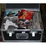 An alluminium flight case containing 45rpm singles mostly pop music c1980s.