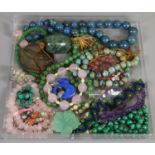 A tray of mixed natural mineral beads including lapis lazuli, rose quartz, turquoise, nephrite,