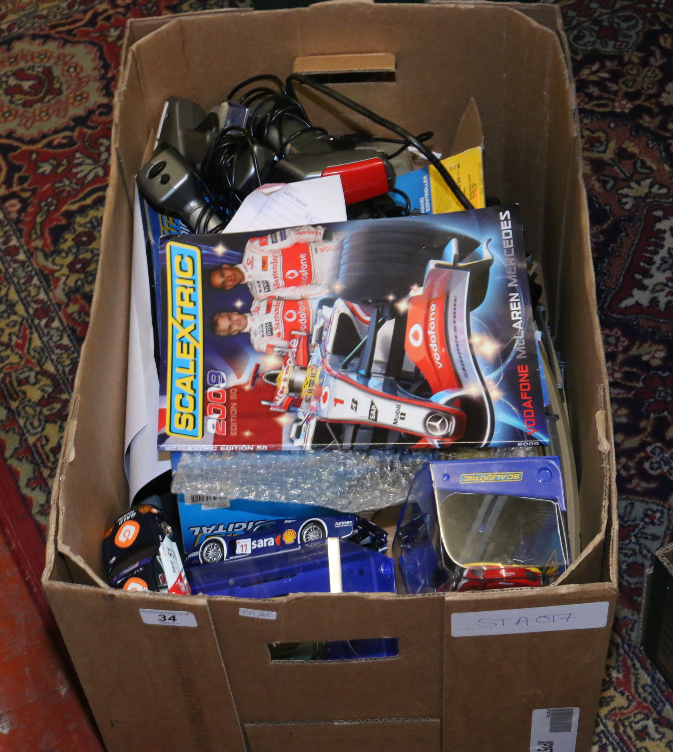 A box Scalextric track, cars and accessories, some cars boxed and including digital pit lane etc.