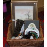 A wicker basket and contents of framed pictures and collectables including Lladro,