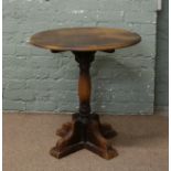 A mahogany Old Charm style side table raised on tripod base.