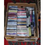 A box of C.Ds mainly rock, pop and classical including Green Day, Cold Play, Elton John etc.