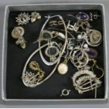 A box of silver earrings including amethyst set, moonstone and multi gem set examples.