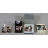 Four small boxes of mixed silver jewellery including charms,