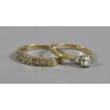 Two 9ct gold rings both set with diamonds.