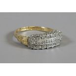 An Art Deco 18ct gold and platinum three row diamond ring, size K.