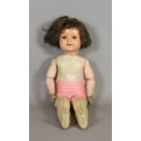 A 1960s cellulose doll with open/close eyes and having jointed composite arms.