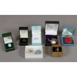 A collection of silver jewellery in boxes including faux turquoise ring, coral pendant etc.