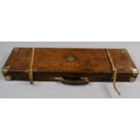 A leather metal bound shot gun case with brass mount William Chatterton 1871 Belton Grange.