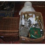 A picnic basket, box of assorted lamp fitting and advertising.