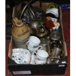 A box of miscellaneous including brass pans, stoneware flagon, silver plate, collectors spoons,