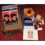 A box of L.P records and 45 rpm singles mainly 1980s pop, original releases and compilation.