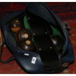 A bag of vintage lawn bowls including lignum vitae examples by Jaques & Sons of London.