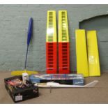 A boxed radio controlled model glider kit, two other gliders and a box of accessories.