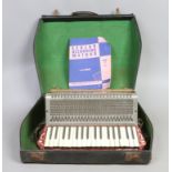 A cased accordian by Pietro.