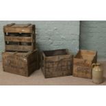 Four old wooden advertising crates and contents,