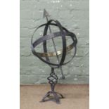 A painted steel armillary sphere on stand.