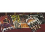 Four vintage rock/metal music posters including Metallica, Megadeath, Slayer,