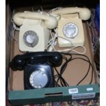 Three old BT dial telephones.