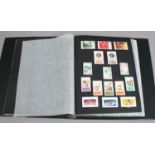 An album of Elizabeth II stamps including Commonwealth and 1950s.
