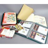 A quantity of stamp and first day cover albums along with empty albums and Stanley Gibbons 2010