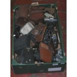 A box of vintage cameras including box cameras, Praktica, Yashica- a twin lense etc.