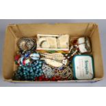 A box of vintage costume jewellery including mink brooch, marcasite necklet and earring set etc.
