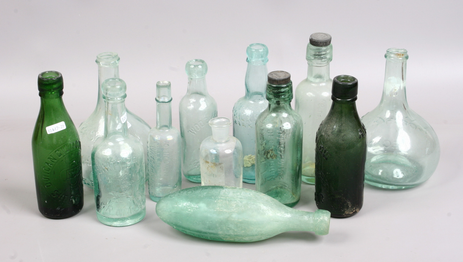 A collection of vintage glass storage bottles.