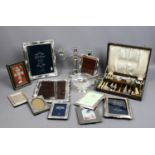 Nine silver plated eizel photograph frames and other silver plate along with a framed set of