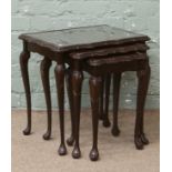 A nest of three mahogany occasional tables.