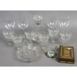 A glass decanter with silver collar, a set of six cut dessert glasses and other glassware,