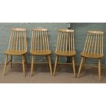 A set of four Ercol style spindle back dining chairs.