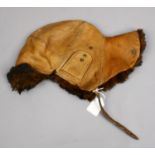 A vintage leather and fur driving hat.