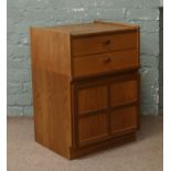 A Nathan retro tea bedside cabinet incorporating two drawers and a cupboard base.