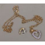 A 9ct gold heart shaped pendant on chain set with gems and a bi metal pendant.