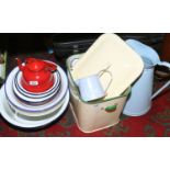 A collection of enamel wares, bread bin, white bowls, water jug, red colander etc.