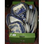 A box of blue and white pottery and china including Burleigh ware willow pattern etc.