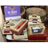 A collection of boxed Diecast cars to include Lledo, Matchbox and a Corgi commemorative D-Day set.