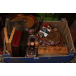 A box of painted decorative wooden items and storage boxes.