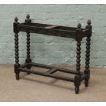 An oak hall stand with bobbin turned supports