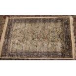 An ivory ground Kashmir rug with tree of life design, 170 x 120cm.