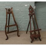 Two carved hardwood folding easels.