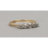 An 18ct gold five stone diamond ring with rub over milligrain setting, size O1/2.