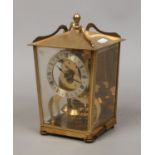 A brass cased Tortion clock by Aug Schatz & Sohne Germany.