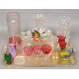 A collection of glasswares consisting of clear and colour glass examples including Murano, vases,