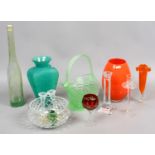 A collection of glassware to include coloured and clear glass examples of vases, candlesticks,