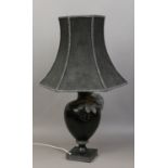 A black ceramic baluster shaped tablelamp and shade adorned with crystals.