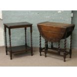 A carved oak barleytwist dropleaf table along with a barleytwist occasional table.