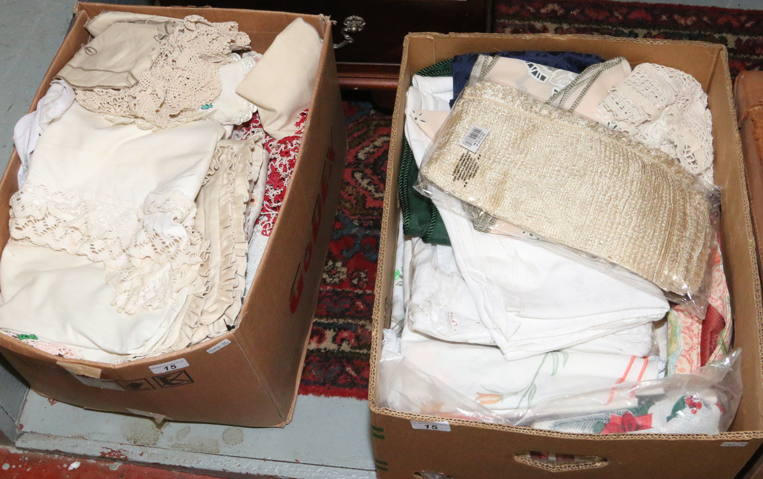 Two boxes of mixed lace and linen.