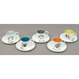 A Susie Cooper china tea service comprising of five cups and saucers decorated with fruit and